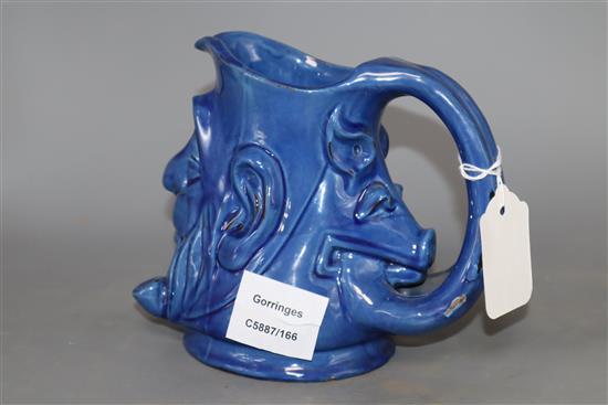 A C.H. Brannam blue glazed double mask jug, height 15cm